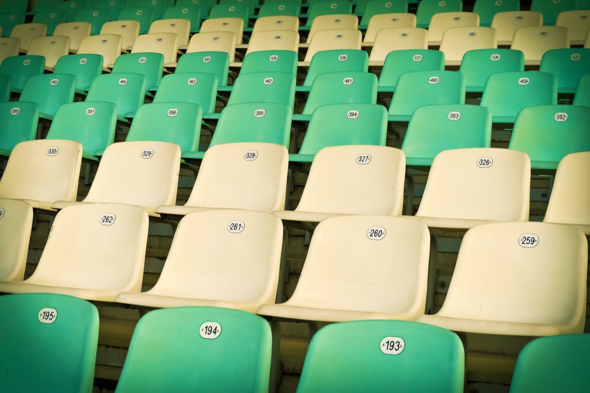 Spectators sitting in EPL stadium seats