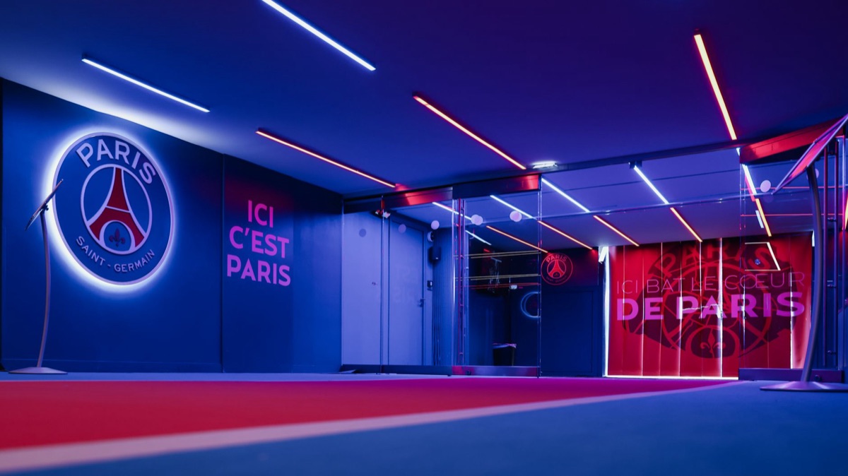 EPL stadium entrance with signs in French