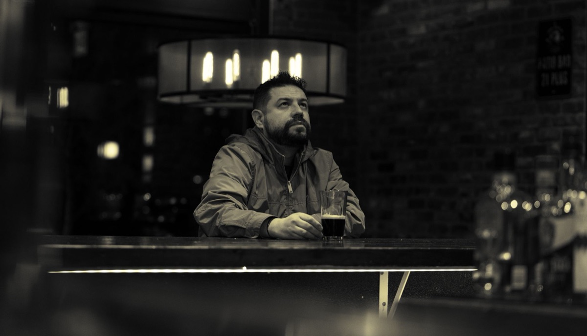 customer with beer glass in london pub