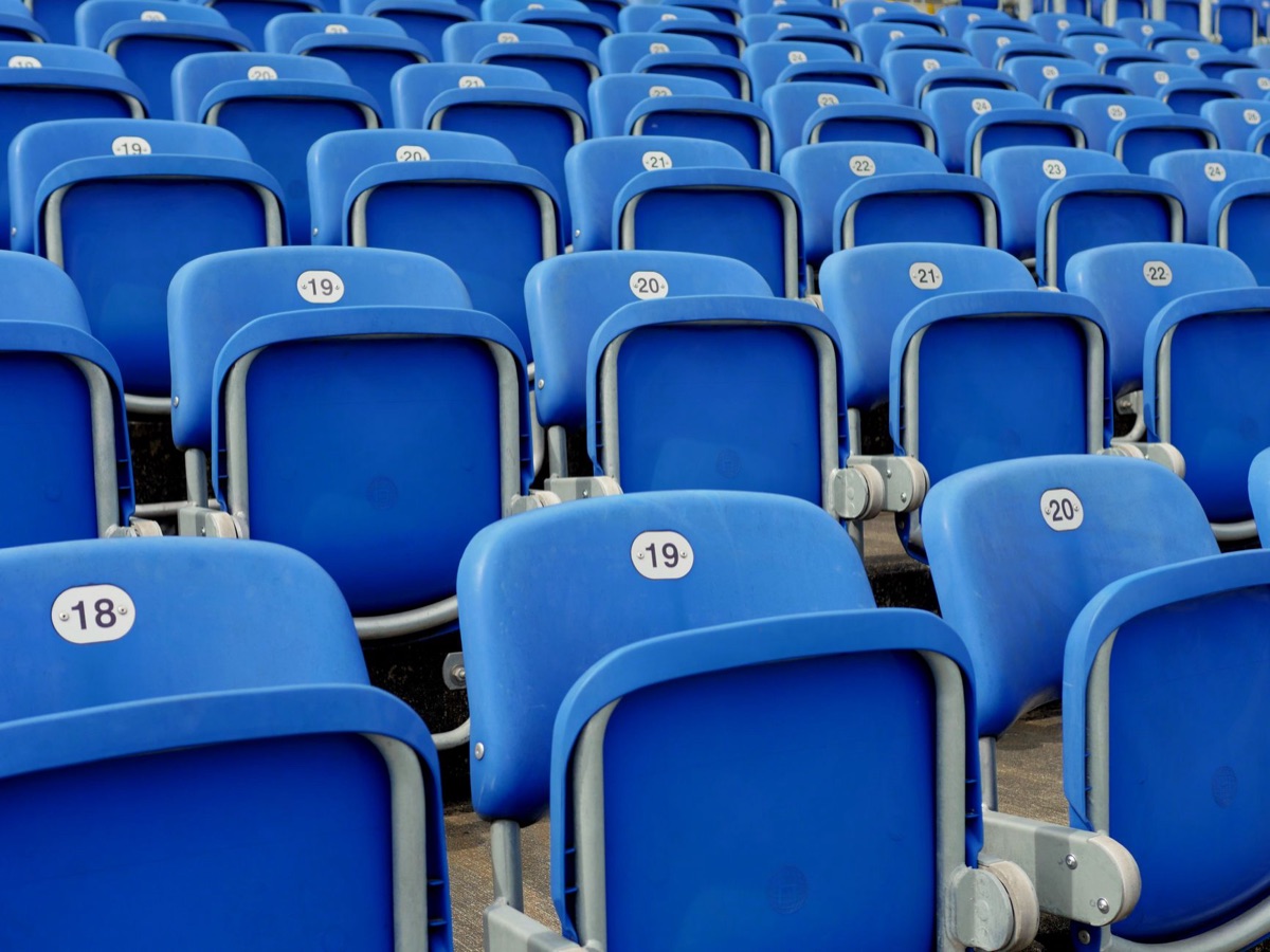 soccer stadium seats with fans in the stands