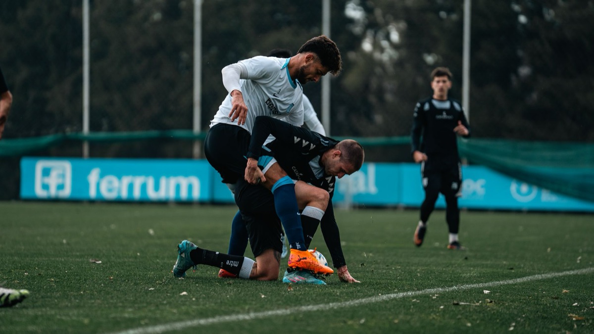 soccer field with players in motion