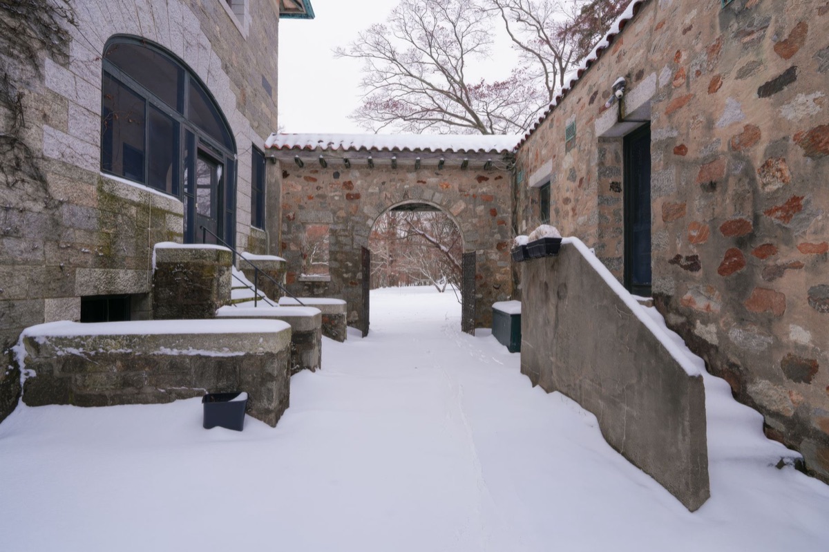West End courtyard entrance with nearby shops and cafes