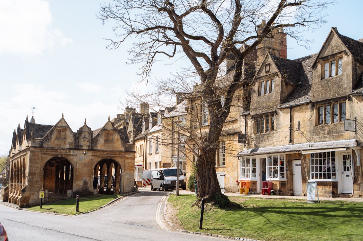 Cotswold train station with passengers boarding a train