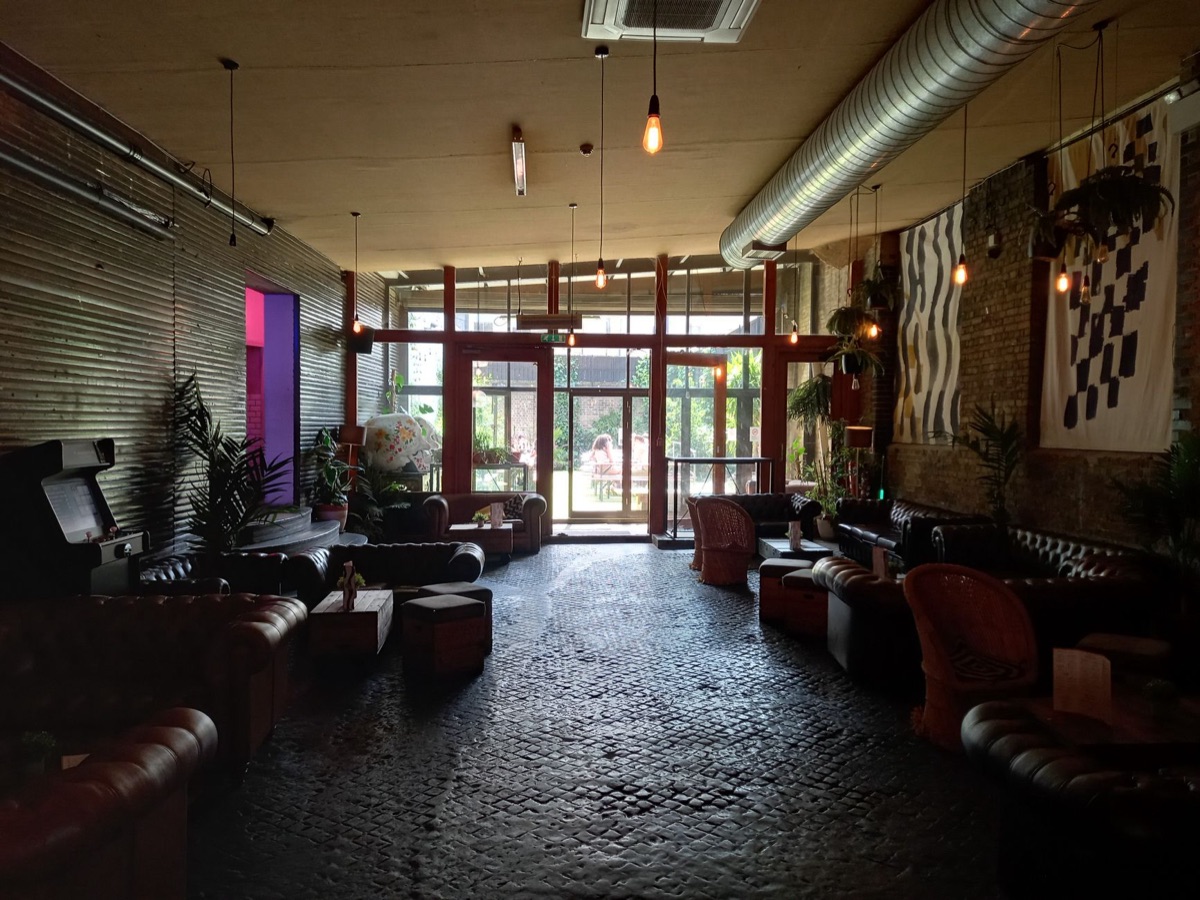 london social club interior with ornate furniture and soft lighting