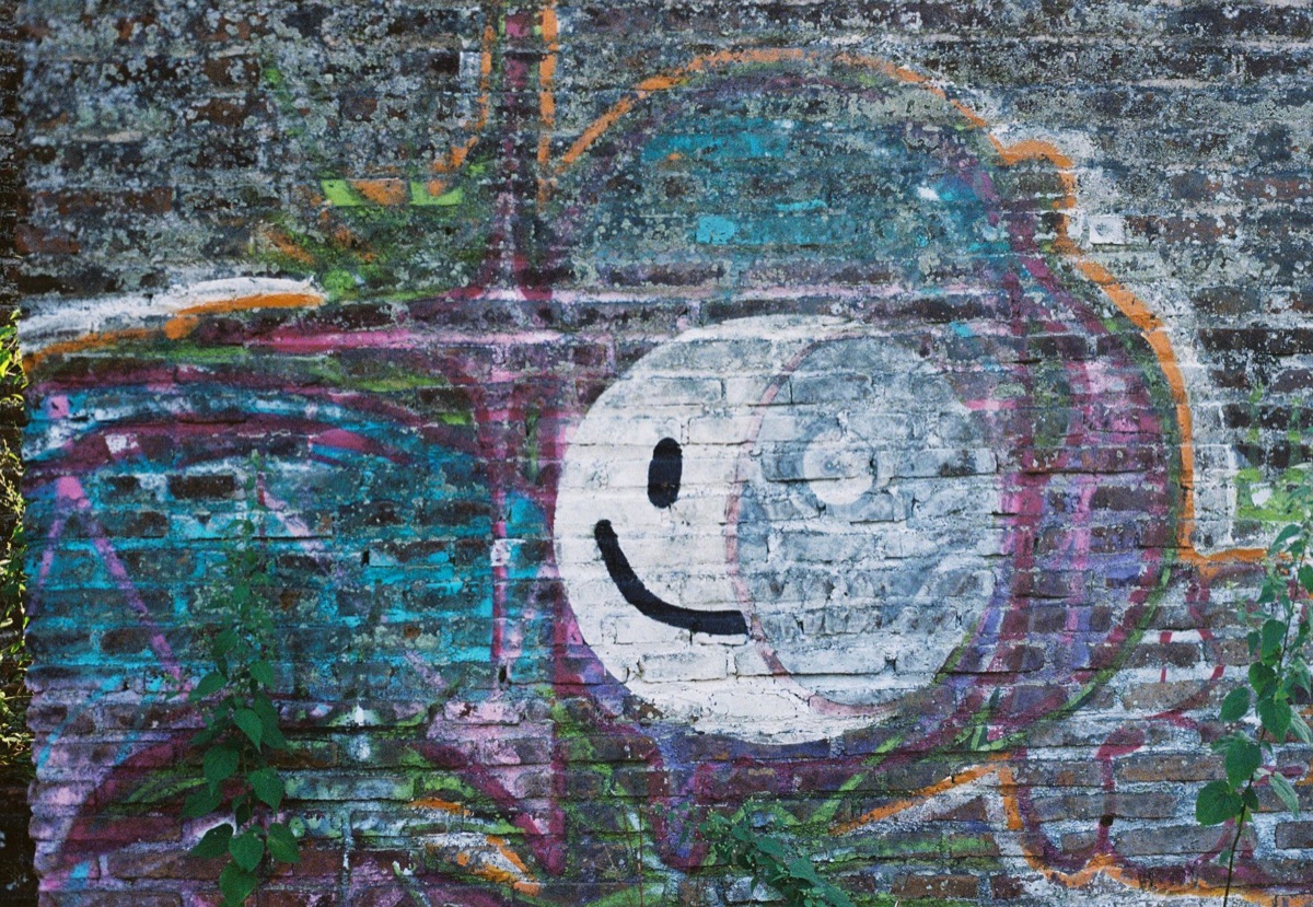 graffiti-covered brick wall