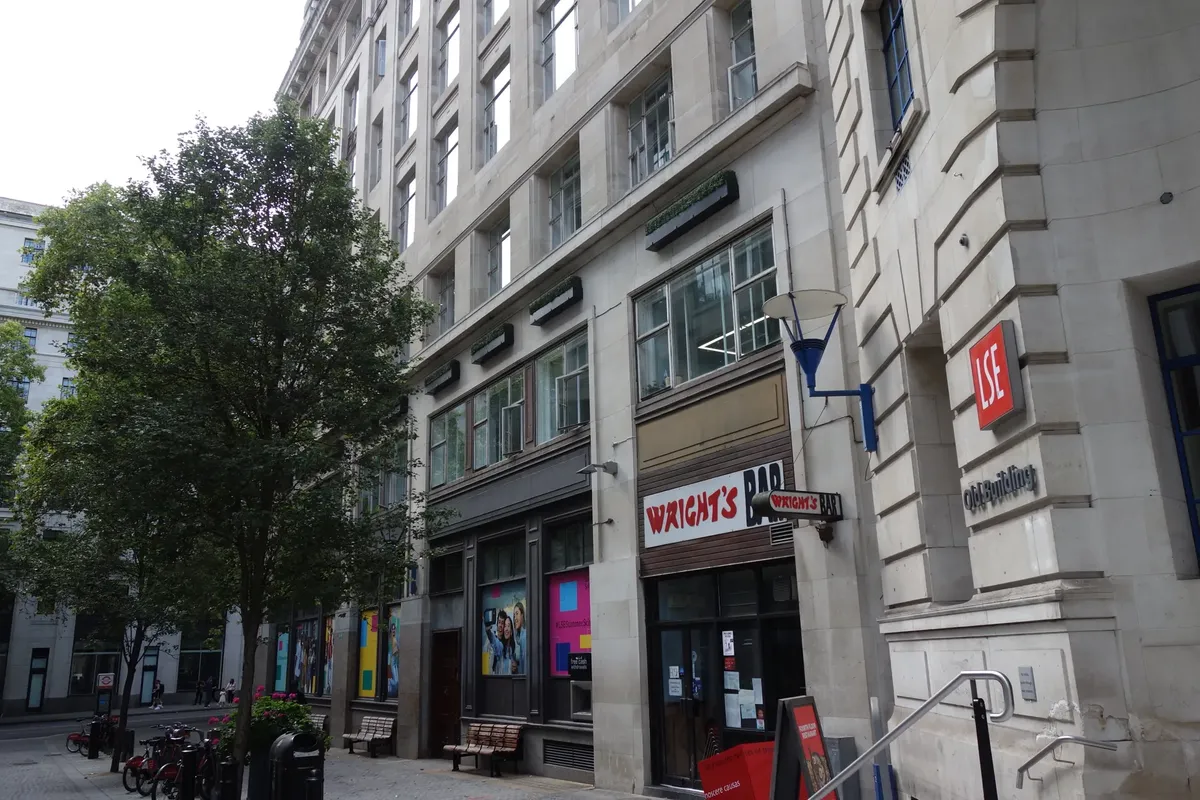 View of the LSE building and Wright's Bar in a quiet London street.
