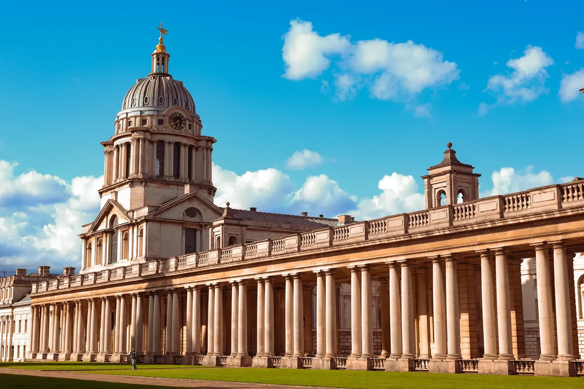 A stunning view of the University of Greenwich's iconic architecture in London, UK under a clear sky.